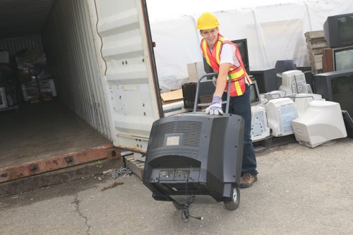 Crew loading waste into a skip during a collection